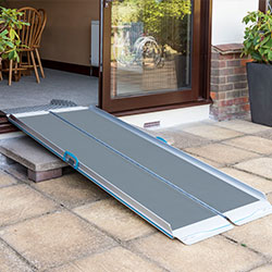 Suitcase & trifold ramp into a house
